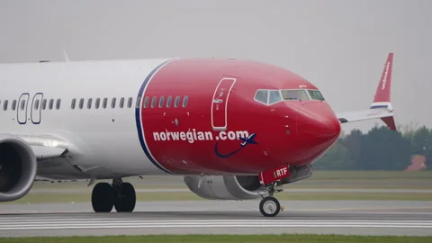 Norwegian Boeing 737 MAX Passenger Airplane Taxi onto Runway, Takeoff Copenhagen Stock Footage 286028945