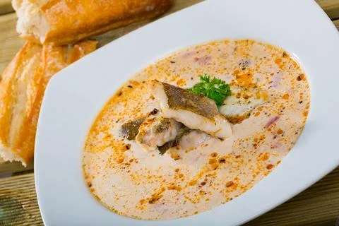 Norwegian cod soup with bread Stock Photos