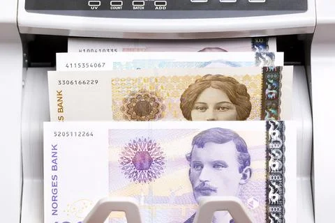 Norwegian crown in the counting machine Stock Photos