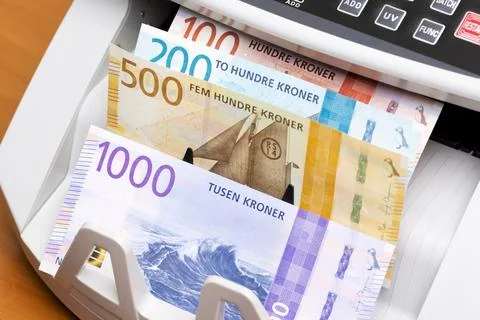Norwegian crown in the counting machine Stock Photos