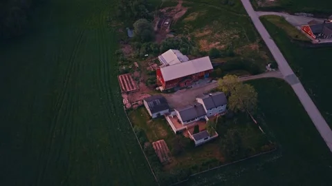 Norwegian Farmstead With Red Barn Surrounded By Green Fields At Sunset. - Stock Footage 340418310