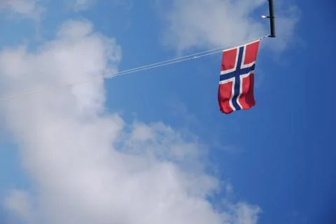 Norwegian Flag waving with blue sky Stock Photos
