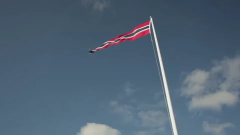 The Norwegian flag on a white flagpole Stock Footage 146133406