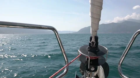 Nose part of ship on waves. Move forward on sea in great white sailing yach Stock Footage 99696744