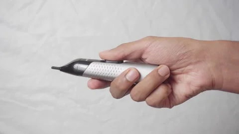 Nose trimmer switch on and off Stock Footage 321406190