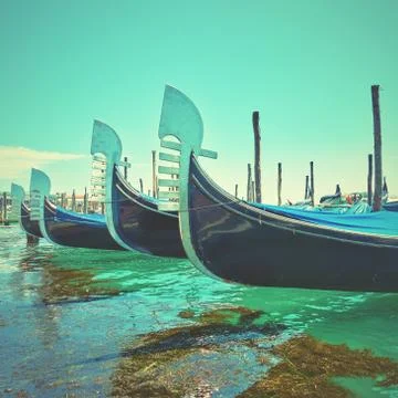 Noses of gondolas in a row Stock Photos