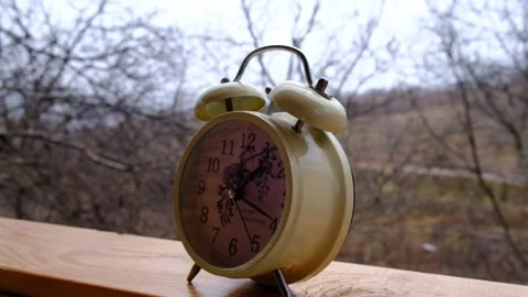 Nostalgia clock standing on the table while snowing, slow motion video I 120 FPS Stock-Footage 227447536