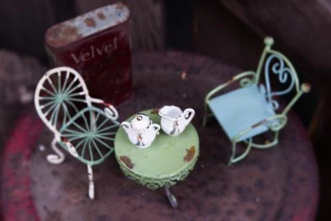 Nostalgia Series: Dollhouse chairs with table and tea set Stock Photos