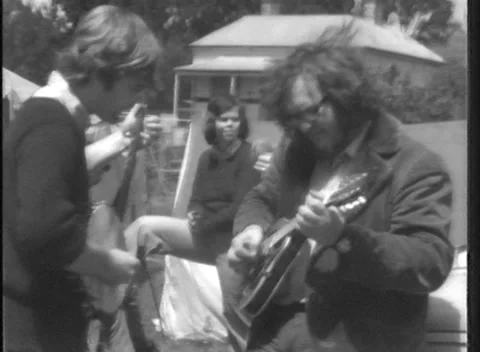 Nostalgic 1970s: Alternative Musicians Jamming Outdoors Stock Footage 138437801