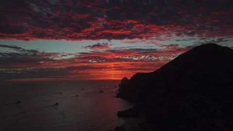A nostalgic aerial view of an epic sunset with red clouds on the horizon, taken 動画素材 333263903