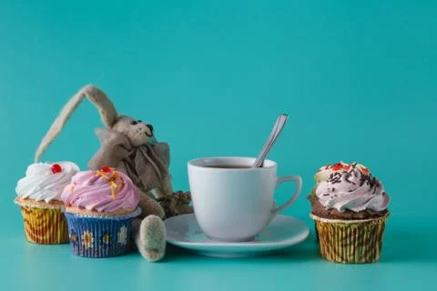 Nostalgic breakfast concept. Rabbit doll with cup of coffee Stock Photos