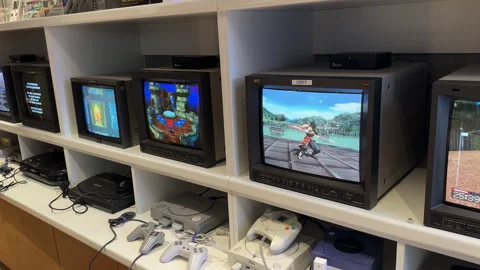 Nostalgic classic CRT televisions displaying fun vintage video games. Stock Footage 313289044
