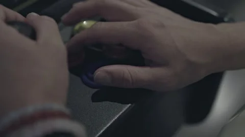 Nostalgic Gaming Experience: Vintage Console Joystick Mastery Stock Footage 256026391