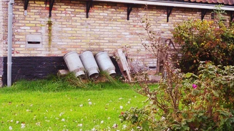 Nostalgic milk churns (cans) Stock Footage