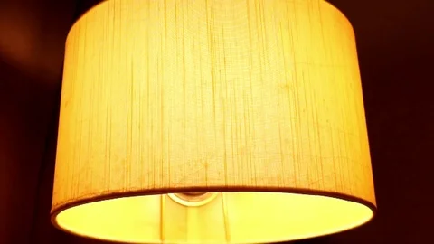 Nostalgic old lamp shining over bed at bedroom. Stock Footage 96669997