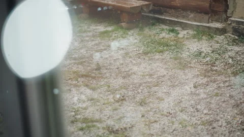 Nostalgic scene through rain. Raindappled garden seen from inside. Inner Stock Footage 334785797