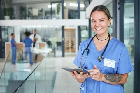 Not all heroes wear capes, some wear scrubs. Cropped portrait of an attractive Stock Photos