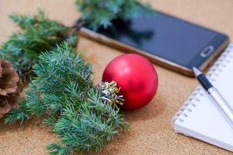 Not completed list of goals in a notebook on a wooden table with Christmas Foto stock