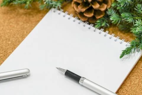 Not completed list of goals in a notebook on a wooden table with Christmas Stock Photos