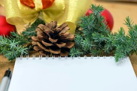 Not completed list of goals in a notebook on a wooden table with Christmas Stock Photos