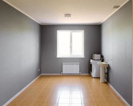 Not equipped empty kitchen room with bright window in new apartment building Stock Photos
