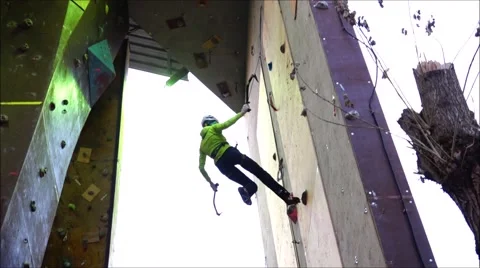 Not experienced climber breaks down the mountain. Motivation. Success Stock Footage 69033452