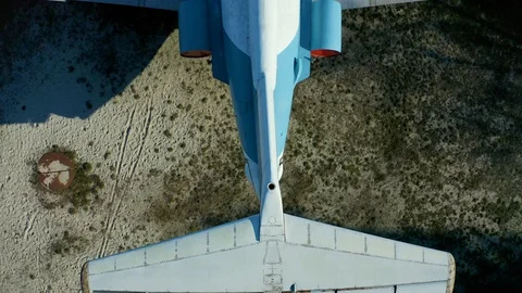Not flying jet small Soviet aircraft on the site as monument, top-down view from Stock Footage 127659098