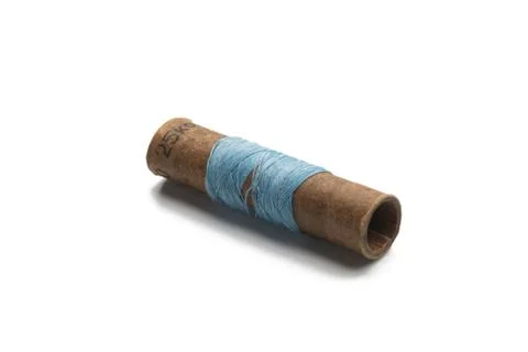 Not full used thread spool single white background Stock Photos