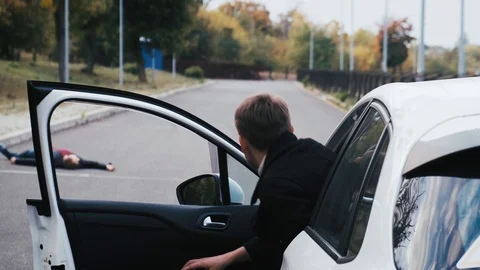 Not an indifferent driver comes to the rescue of a downed pedestrian Stock Footage 117108506