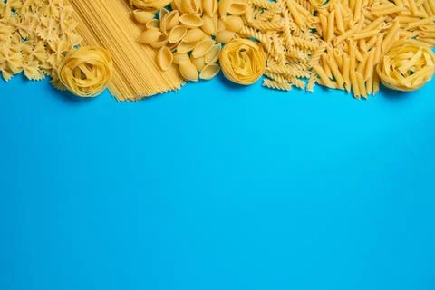 Not prepared a dry paste of different species on a blue background in various Stock Photos