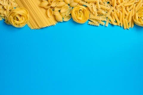 Not prepared a dry paste of different species on a blue background in various Stock Photos