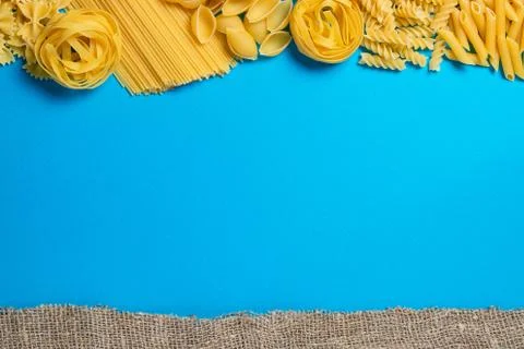 Not prepared a dry paste of different species on a blue background in various Foto stock