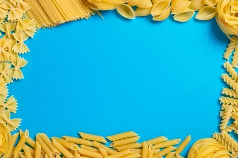 Not prepared a dry paste of different species on a blue background in various Stock Photos