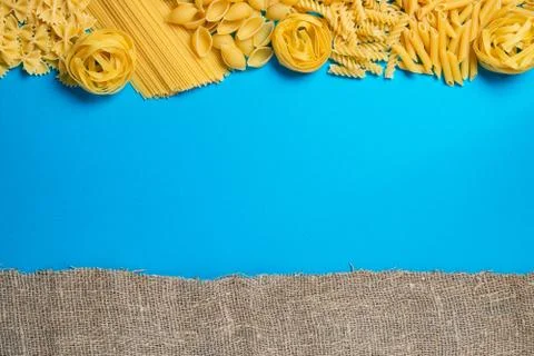 Not prepared a dry paste of different species on a blue background in various Stock Photos