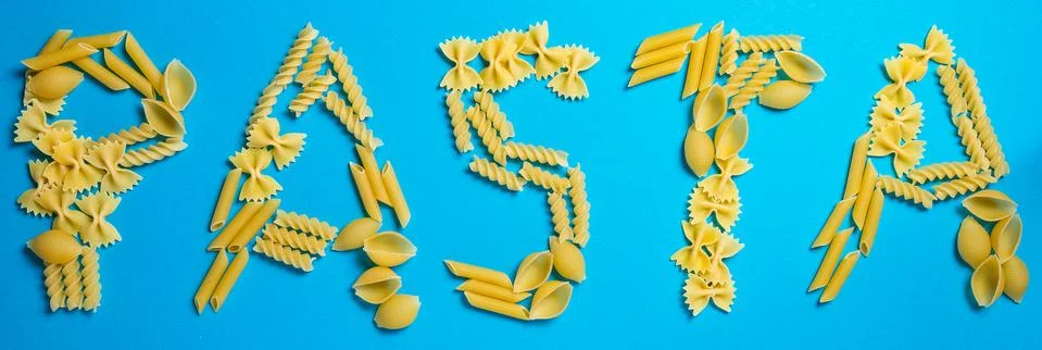 Not prepared a dry paste of different species on a blue background in various Stock Photos