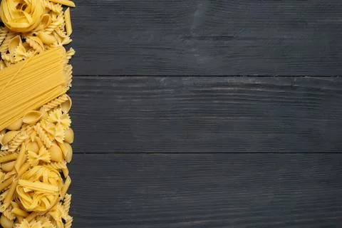 Not prepared a dry paste of different species on a black background in variou Stock Photos