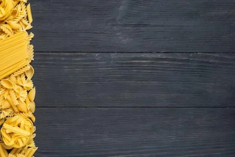 Not prepared a dry paste of different species on a black background in variou Stock Photos