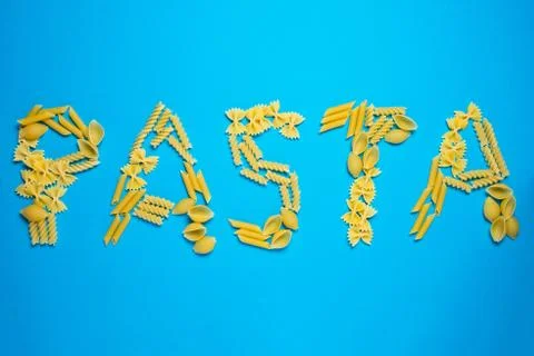 Not prepared a dry paste of different species on a blue background in various Stock Photos