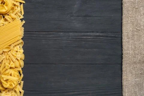 Not prepared a dry paste of different species on a black background in variou Stock Photos