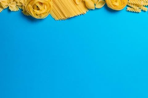 Not prepared a dry paste of different species on a blue background in various Stock Photos