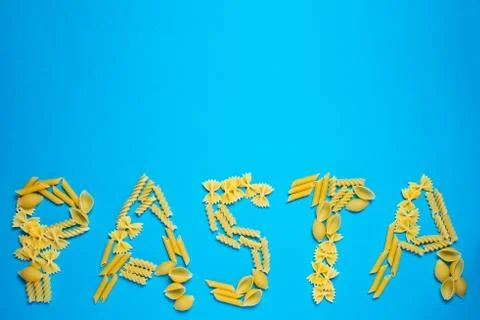 Not prepared a dry paste of different species on a blue background in various Stock Photos