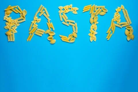 Not prepared a dry paste of different species on a blue background in various Stock Photos