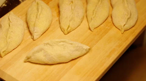 Not ready home baking is on the cutting board. Stock Footage 57343355