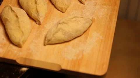 Not ready home baking is on the cutting board. Stock Footage 57344152