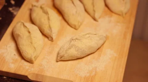 Not ready home baking is on the cutting board. Stock Footage 57344643