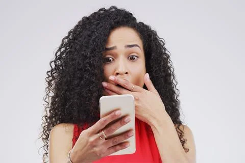 Not for sensitive viewers. Studio shot of a young woman looking surprised while Stock Photos