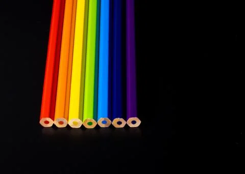 Not sharped colored pensils showing rainbow on black background	 Stock Photos