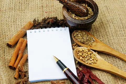 Note book and herb Stock Photos