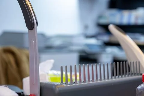 Note Book Binding Machine  with printers in the background Stock Photos