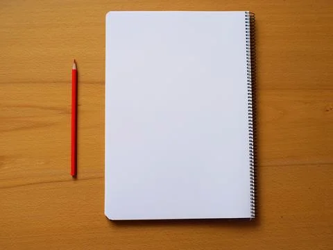 Note book with blank page next to pencil 写真素材